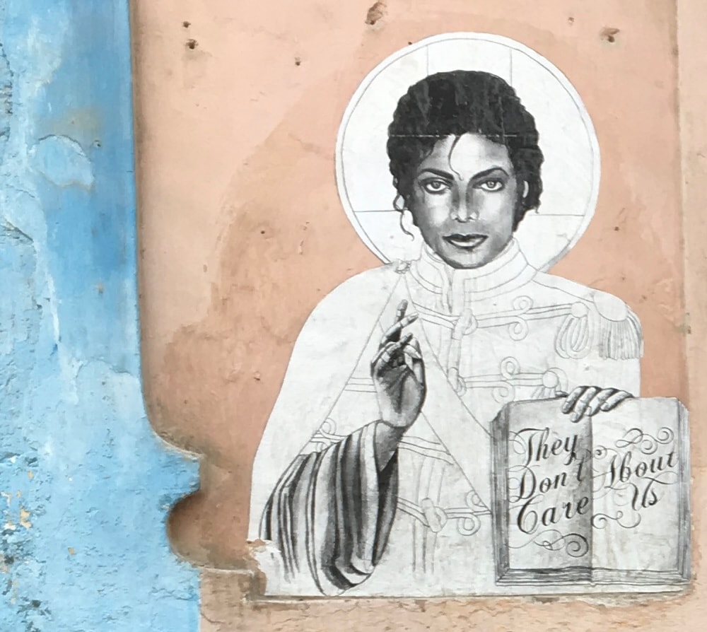 They Don't Care About Us — street art mural in Havana